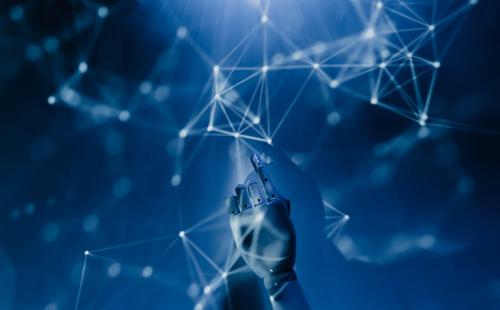 Robot pointing at a wall with lights and shapes