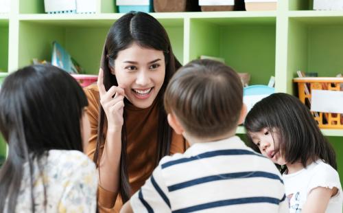 Teacher with young children