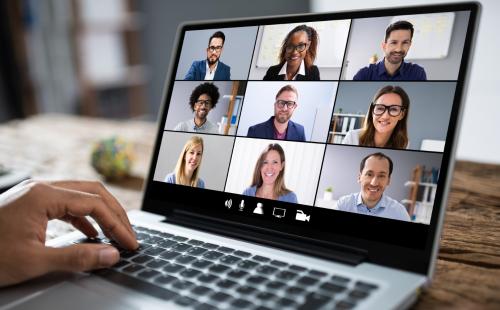 Online meeting shown on a laptop screen