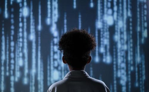 Child looking at a stream of data