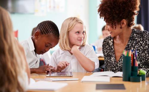 Teacher with two young pupils