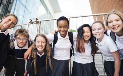 Huddle of school pupils