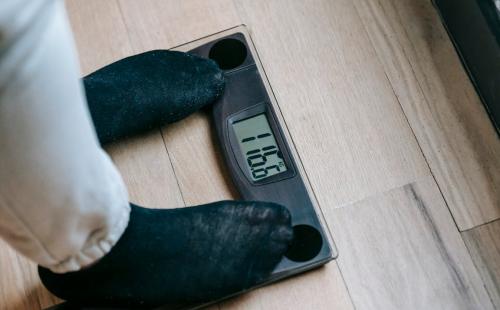 Person standing on weighing scales