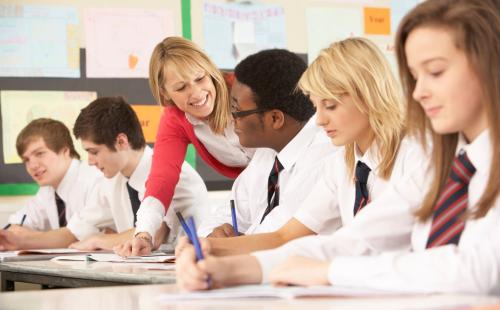 Teacher talking to pupil