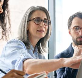 Man and women sat in front of computer