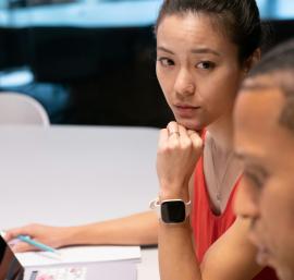 Two people working together at a desk
