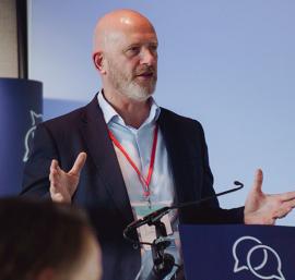 Trust leader speaking at an event